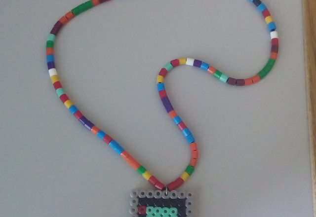 Colored perler beads necklace with Game Boy DMG 001