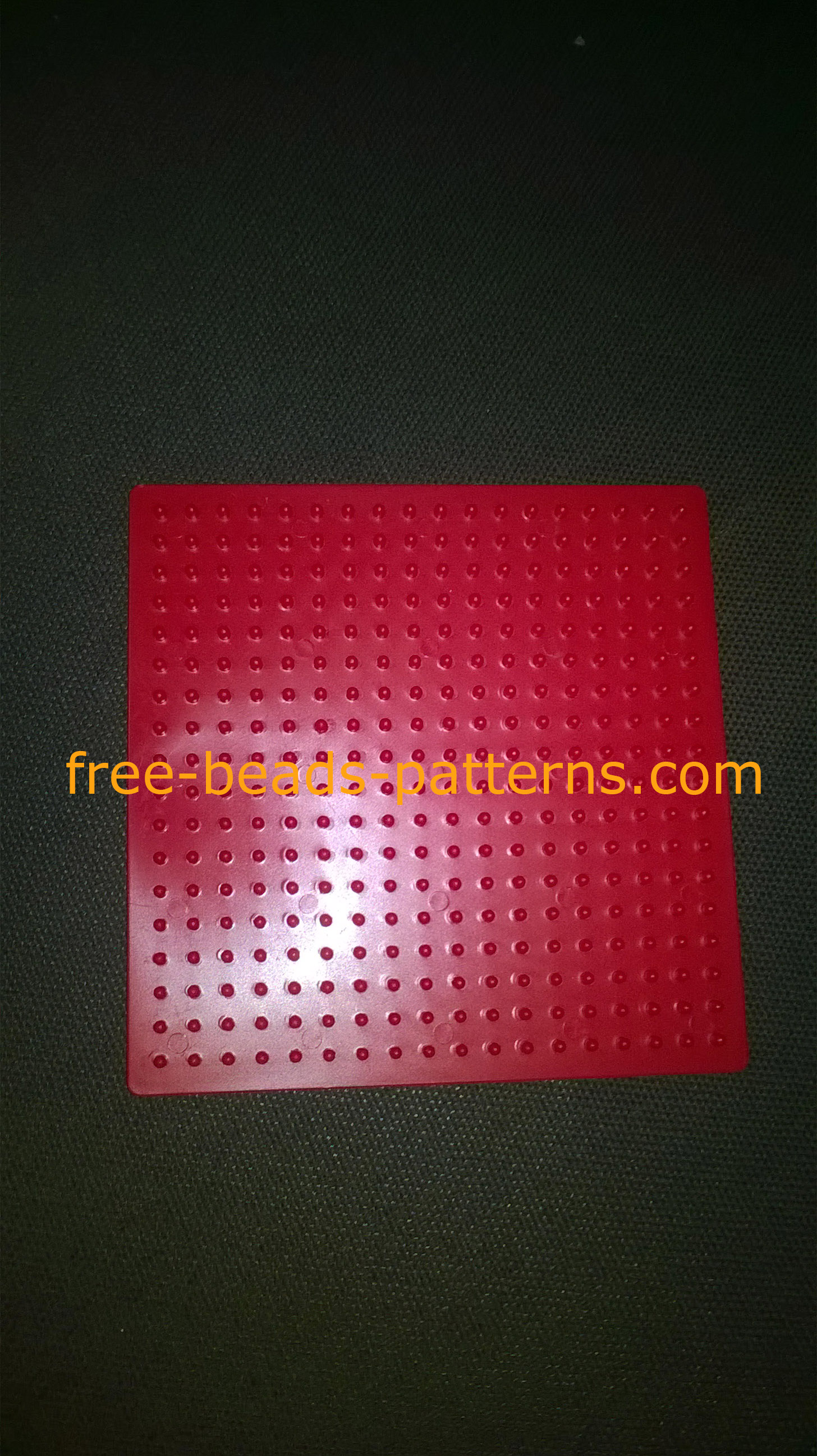 Ikea Pyssla perler beads red small square pegboard photo