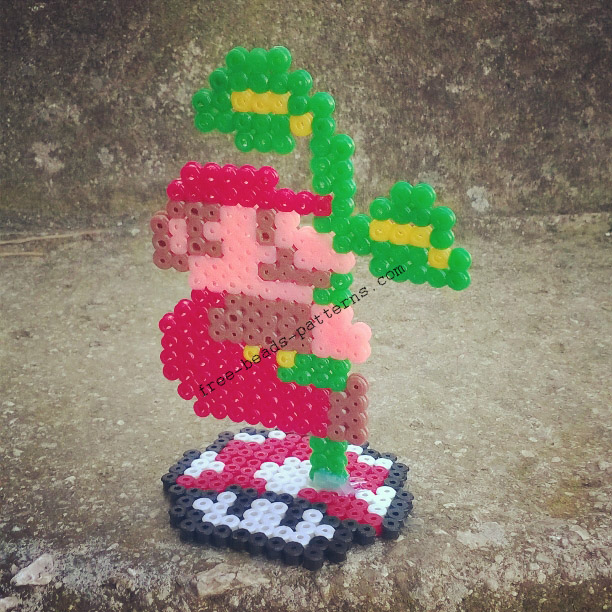 Super Mario Bros climbing the plant 2D perler beads on pedestal photos (2)