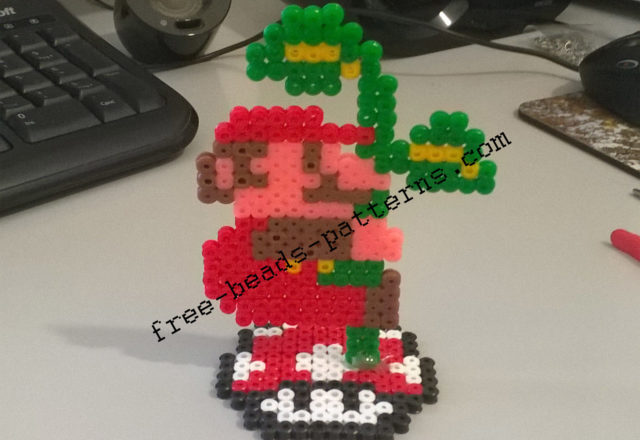 Super Mario Bros climbing the plant 2D perler beads on pedestal photos (3)
