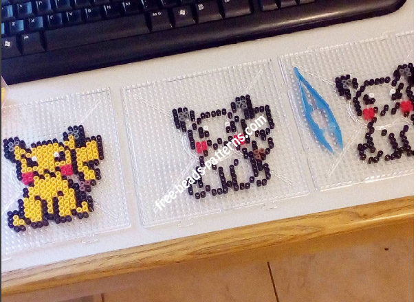 Three Pikachu perler beads pyssla work photo