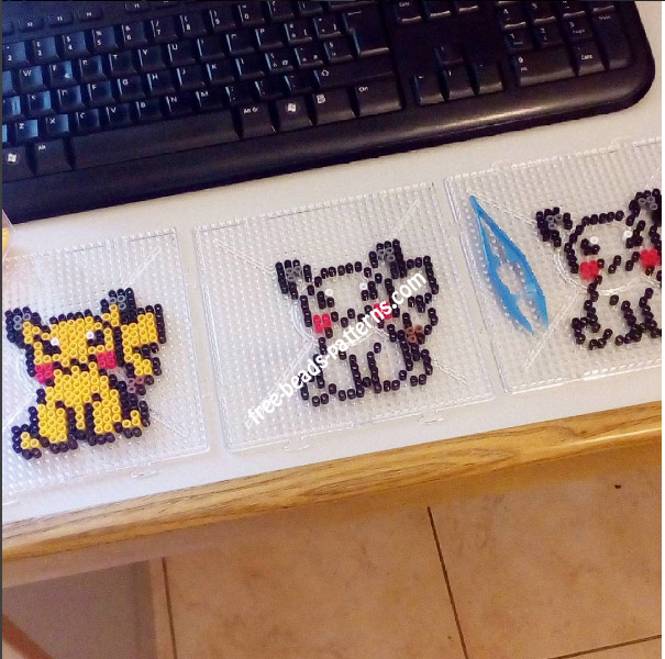 Three Pikachu perler beads pyssla work photo